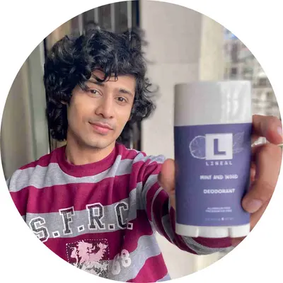 A Boy holding lineal MW deodorant