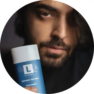 A boy holding lineal BM deodorant