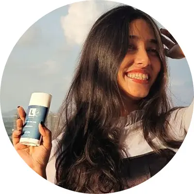 A Girl holding lineal BM deodorant